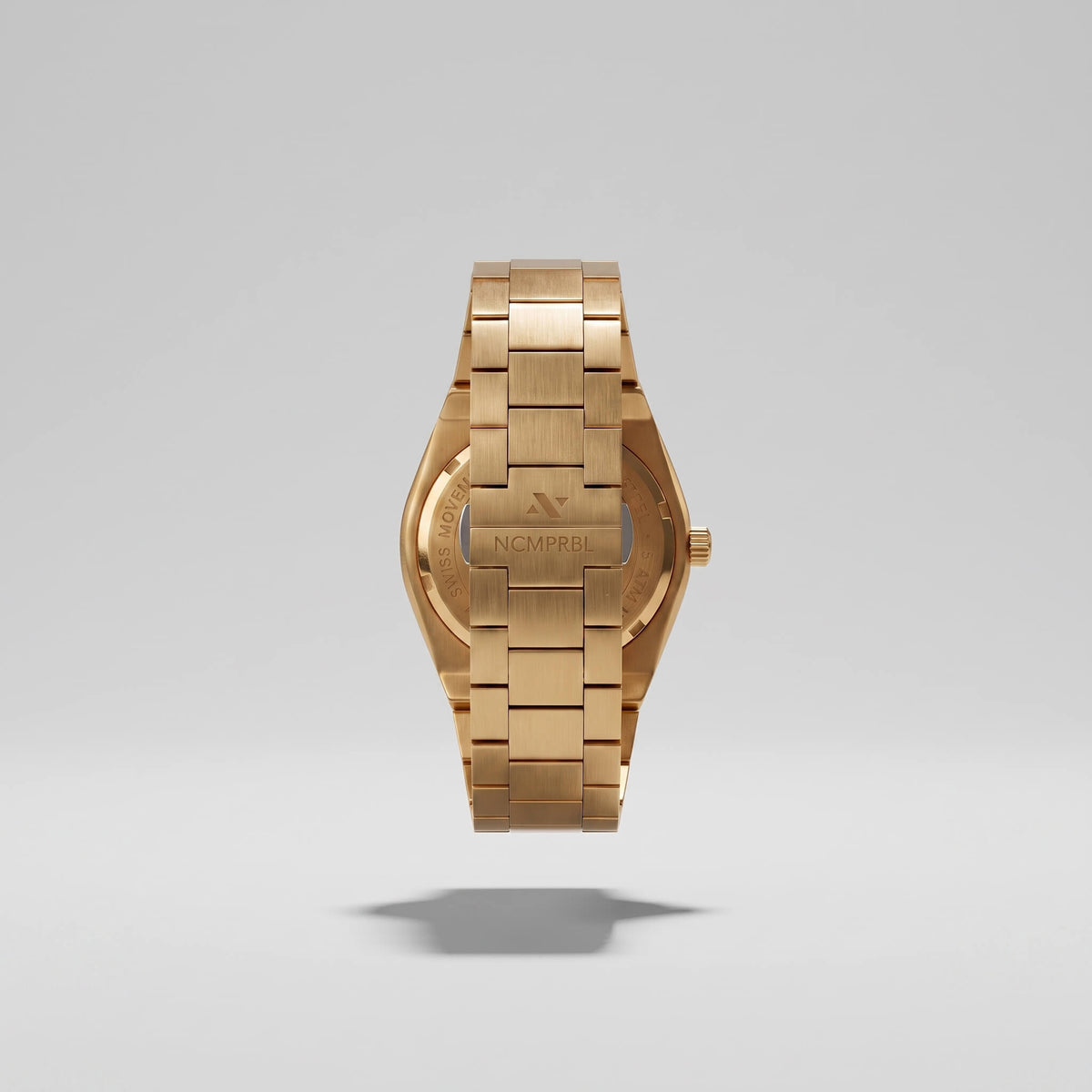 Caseback of an NCMPRBL Elevate Link gold-tone Swiss quartz watch