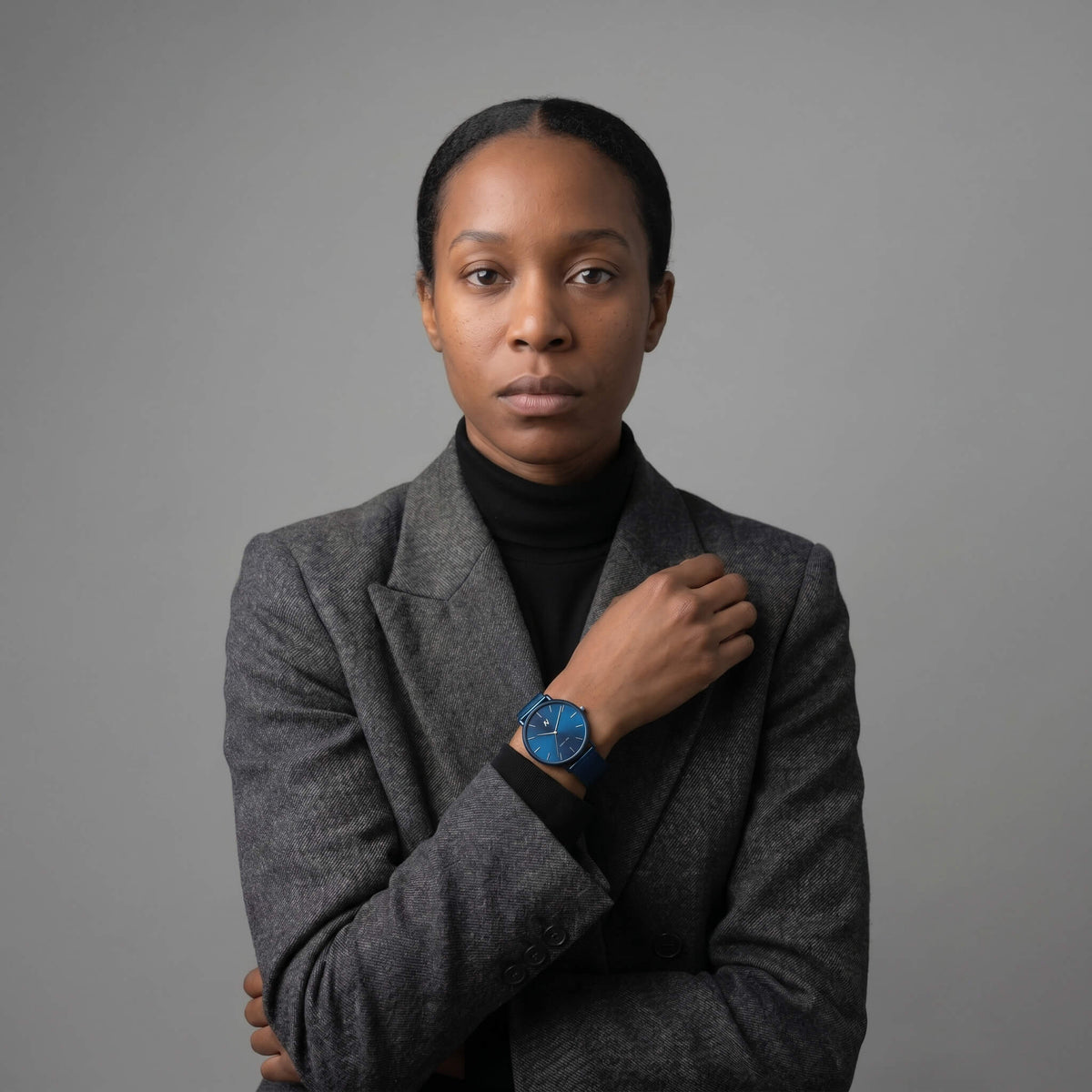 Advance Midnight Blue women’s watch 36MM with blue mesh strap styled with gray coat, try virtual watch on