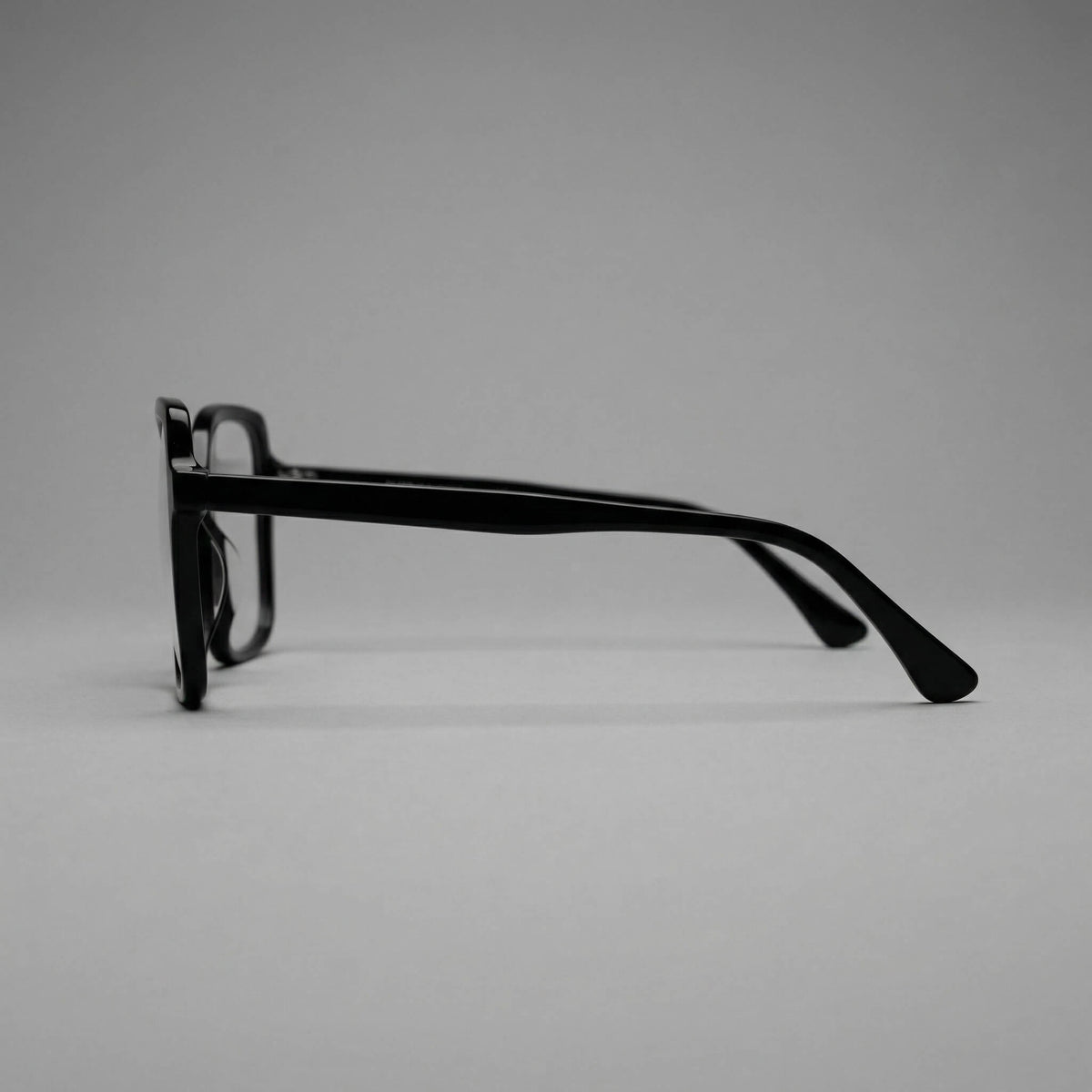 NCMPRBL Aura 01 obsidian black soft square glasses side view highlighting minimalist luxury frame design