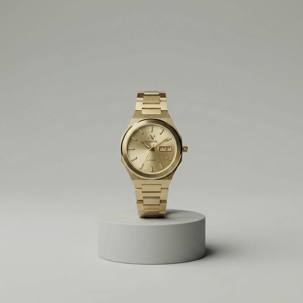 NCMPRBL Ascend Aurel 36MM automatic champagne gold link bracelet watch on pedestal, virtual try-on available