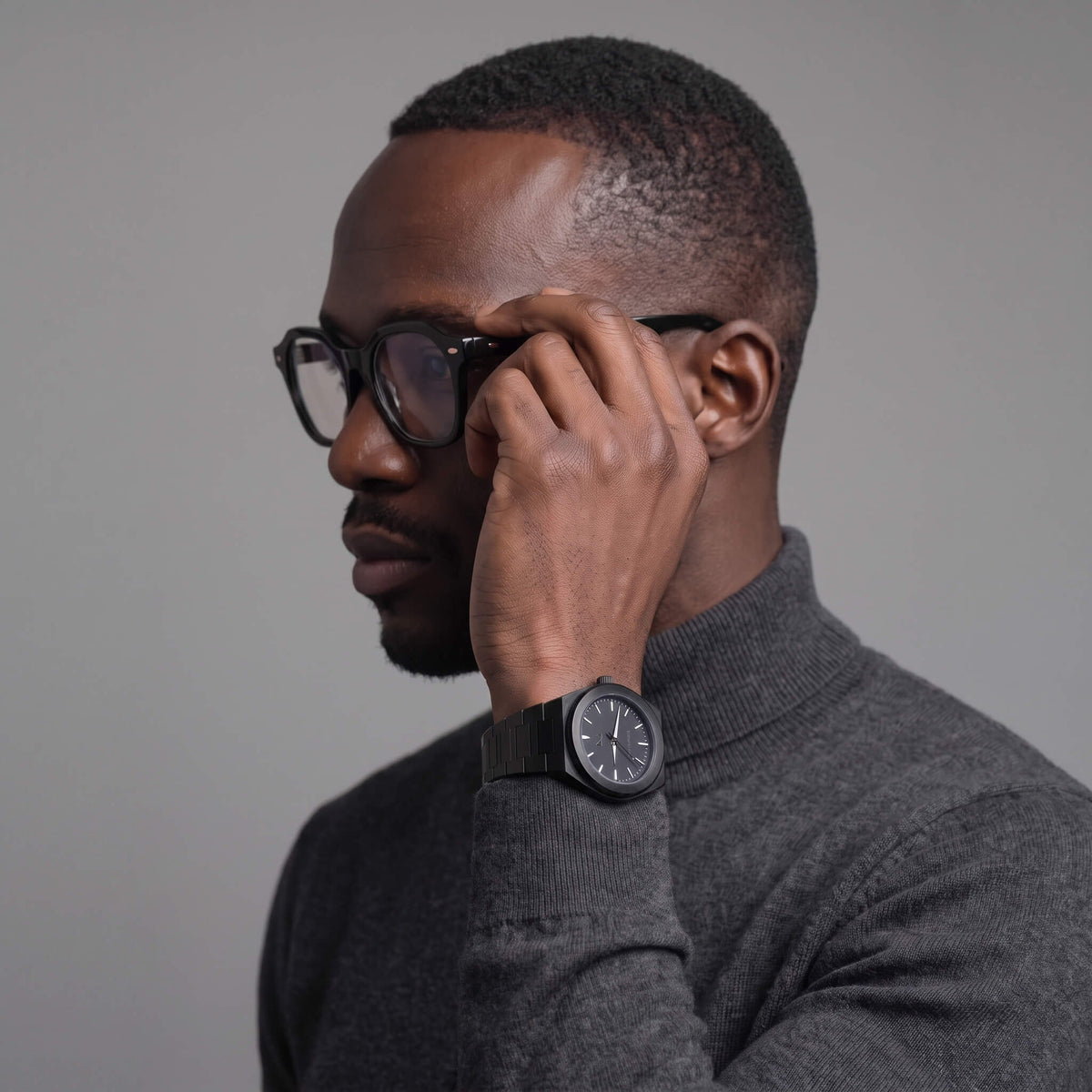 NCMPRBL Elevate Link Phantom black watch with Focused black geometric eyeglasses