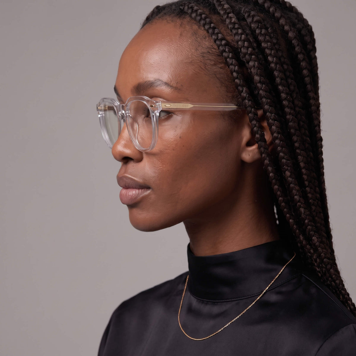 Left side view of female model wearing Clearview 46mm clear geometric glasses