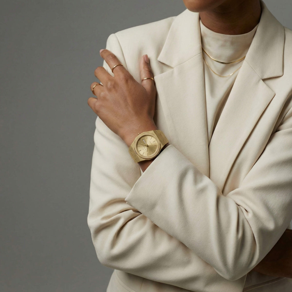 NCMPRBL Ascend Givré 40mm gold watch styled with beige blazer featuring virtual try-on online