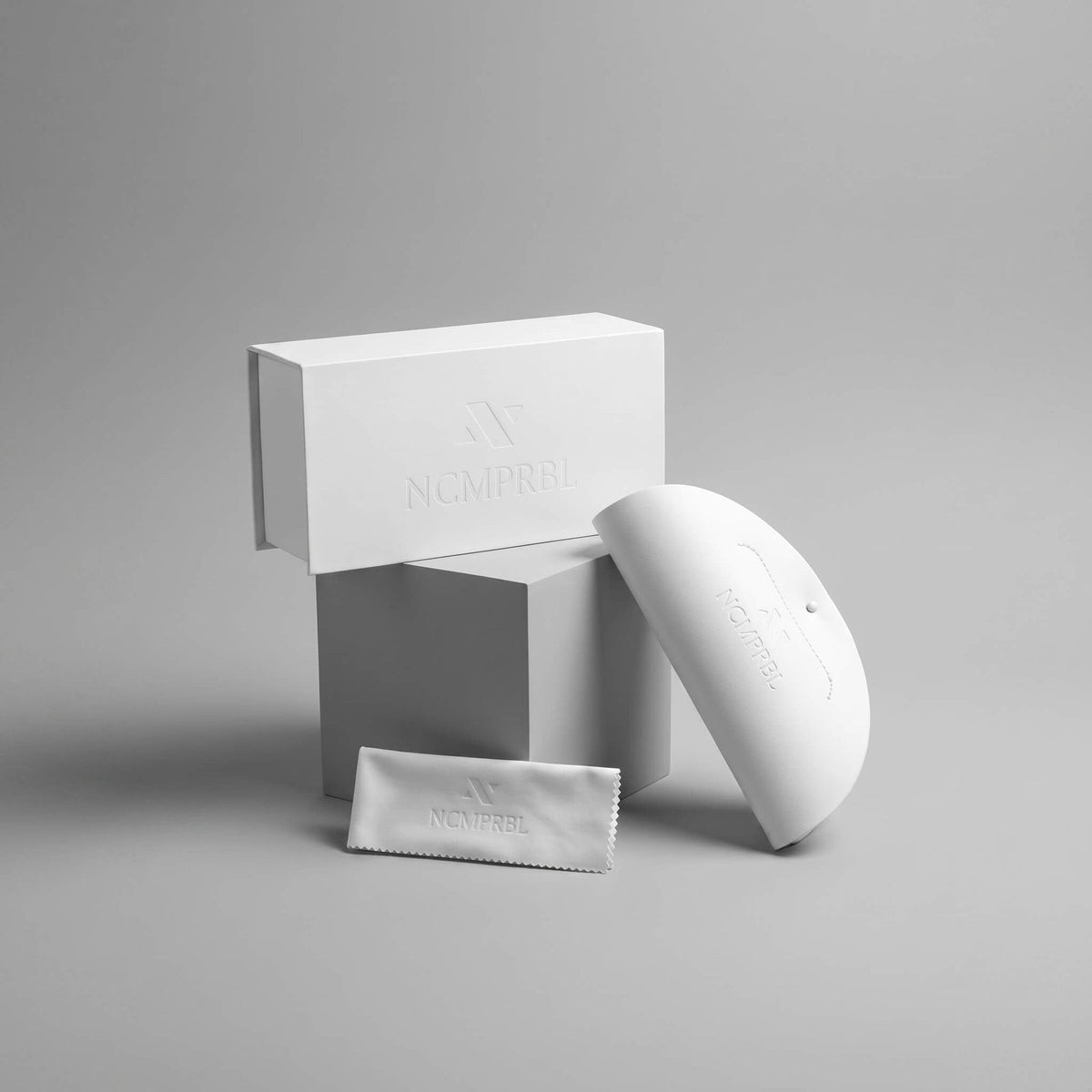 NCMPRBL eyewear case and microfiber cleaning cloth