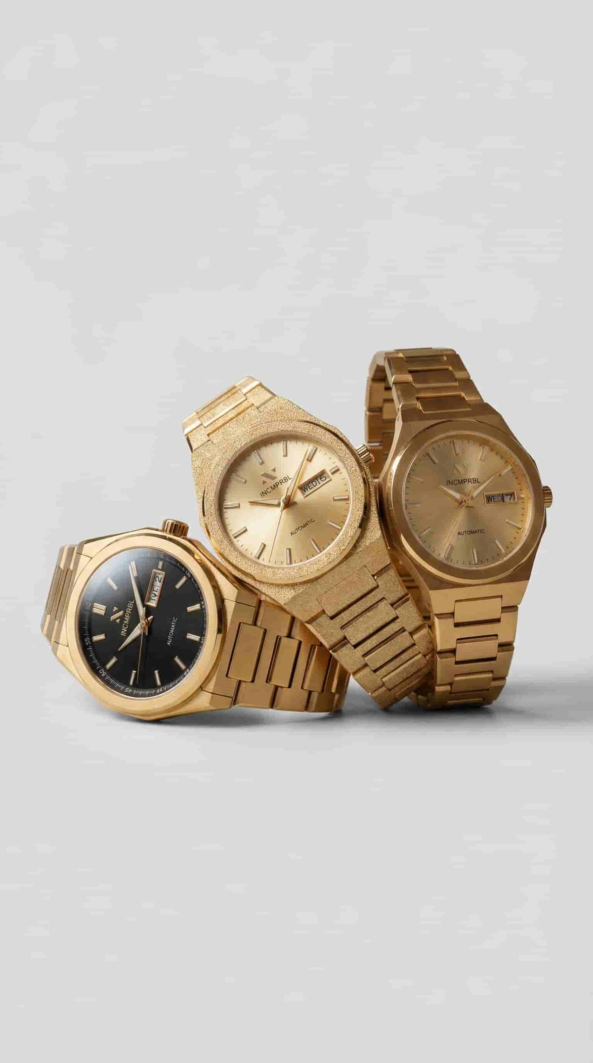 Ascend automatic watch collection showcasing gold-toned timepieces with minimalist dials.