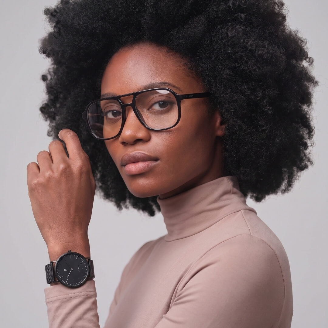 Axis Onyx Flat Top 53mm black eyeglasses worn by female model, showcasing designer eyewear with NCMPRBL virtual try-on