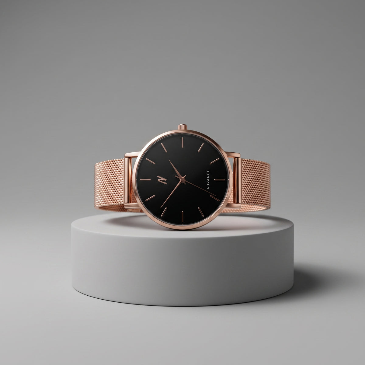 NCMPRBL Advance CRWN 36MM rose gold Milanese mesh quartz watch with black dial on a gray pedestal
