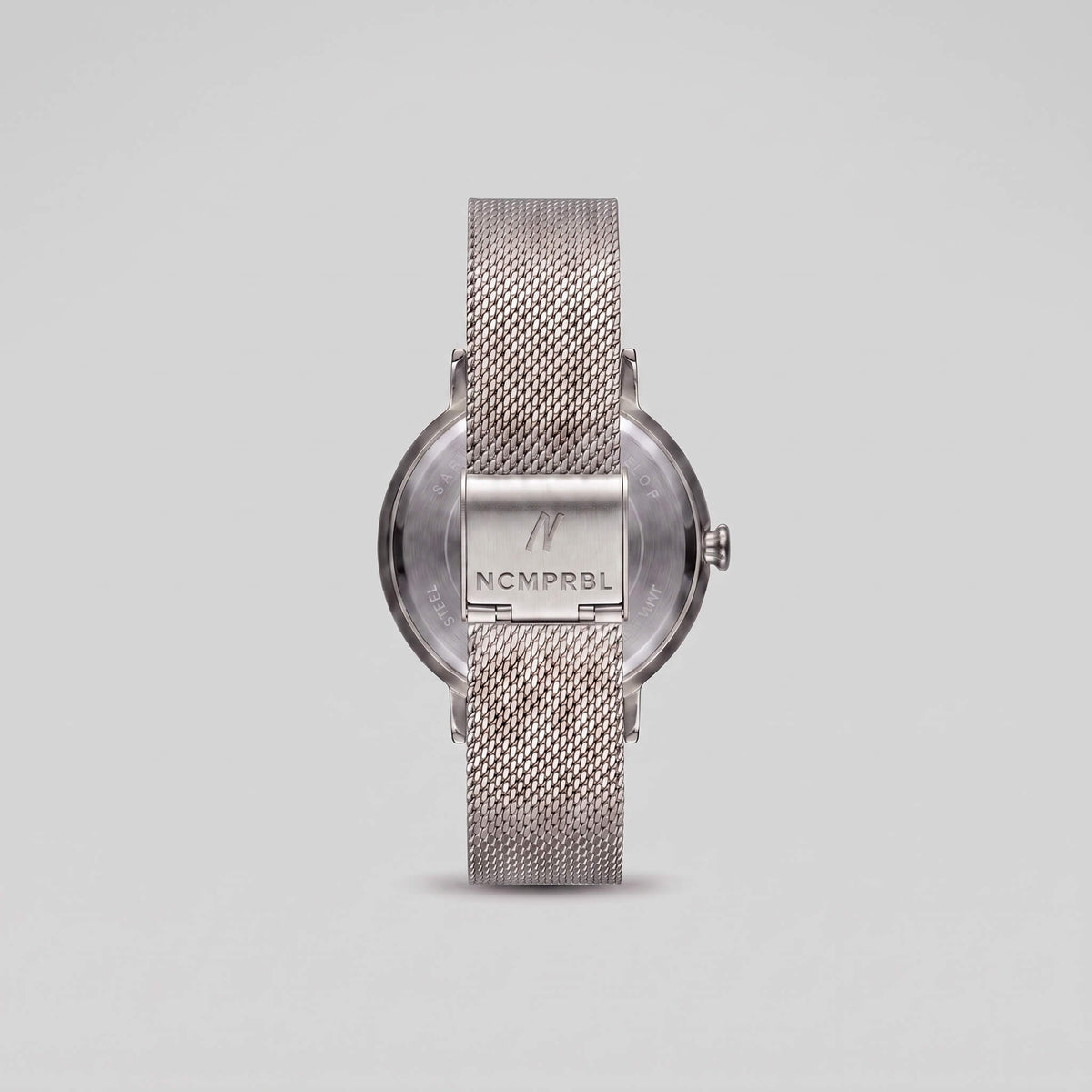 Silver Milanese mesh bracelet clasp with engraved NCMPRBL logo
