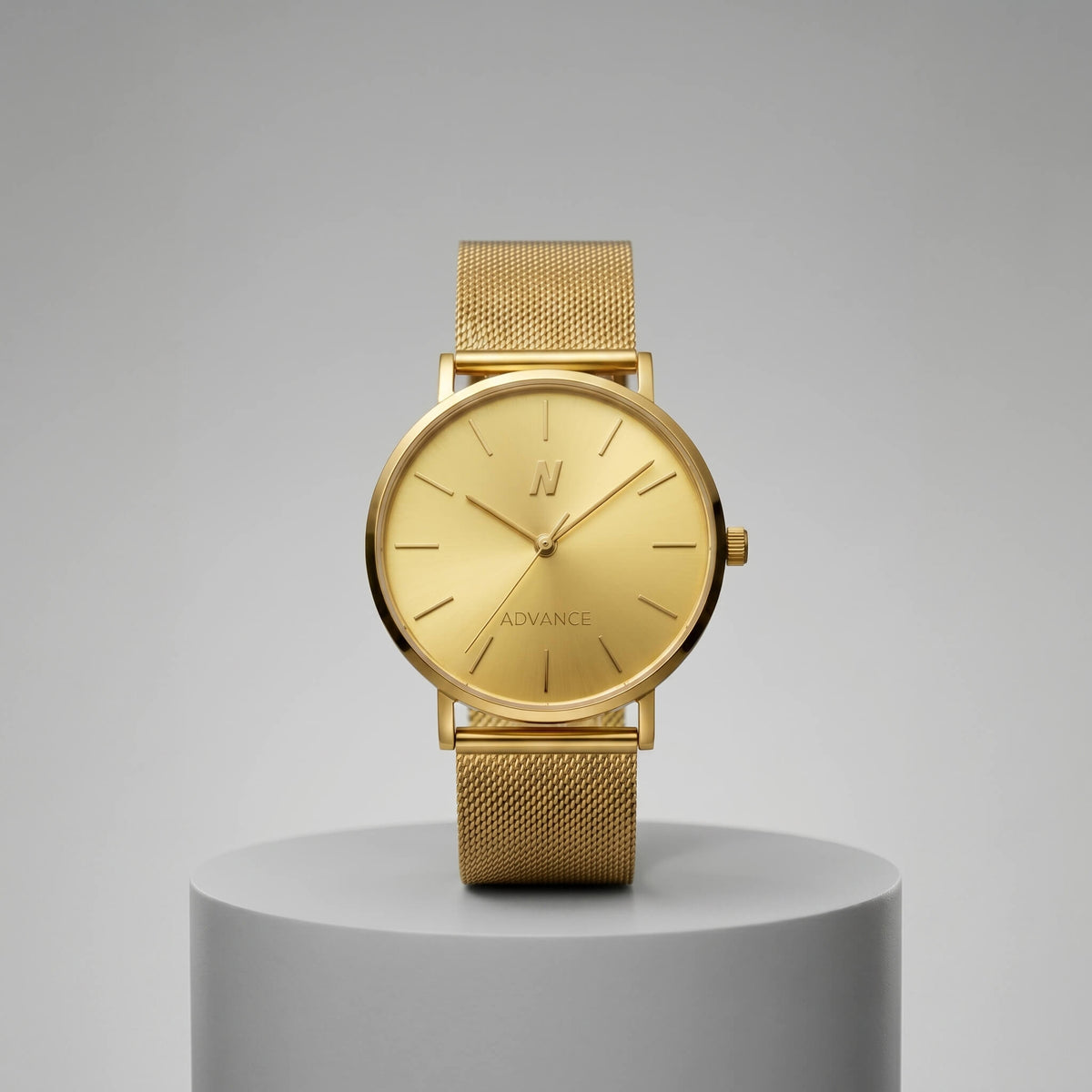 Advance Champagne Gold Quartz 36MM watch with gold mesh strap on gray display