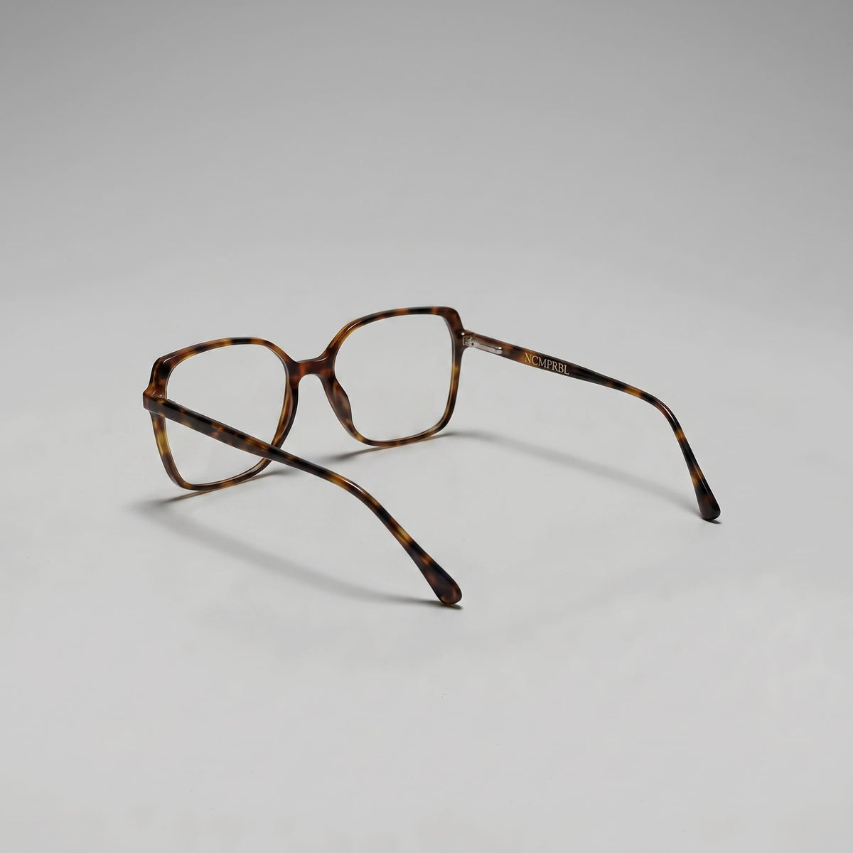 Aura 02 Poise 53MM eyewear tortoise frames displayed with clear lenses