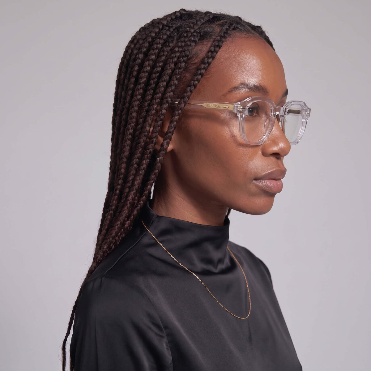 Side profile of female wearing Clearview 46mm geometric clear glasses, minimalist style
