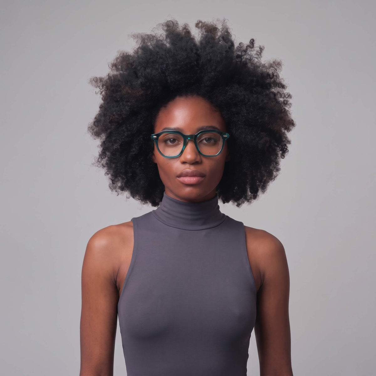 Woman wearing NCMPRBL Manifest 46mm geometric teal eyeglasses, front view