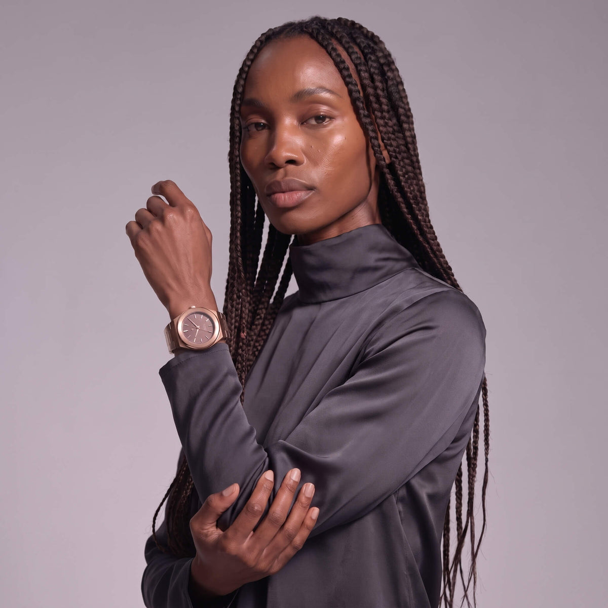 Elevate Link Mocha rose gold watch styled on wrist of black woman, front view